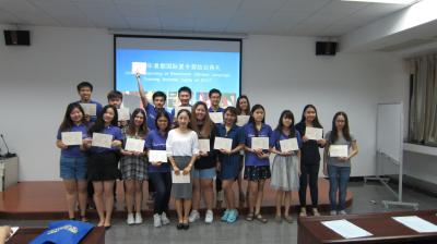 Ms. Guo Ting and students have group photo taken after awarding certifications