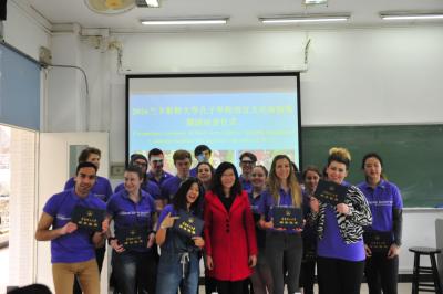 Ms. Pei Xiaorong and students have group photo taken after awarding certifications