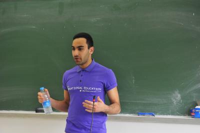 Student representative Kazim Hassan is giving a speech