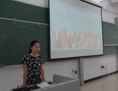 Ms. Xiao Juan, Chinese teacher of SIE is giving speech