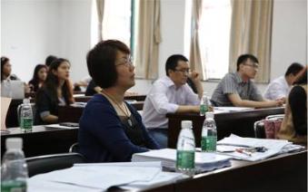 Professor An listening to student reports Professor An listening to student reports